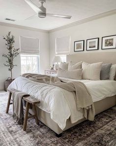 a large bed sitting in a bedroom on top of a rug