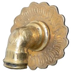 an antique brass door knob with ornate design