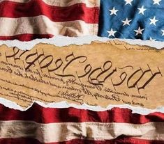 an american flag with the declaration of the united states on it and torn paper that says, we the people