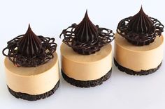 three desserts with chocolate and vanilla frosting on top