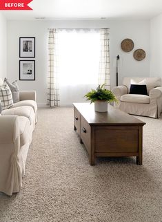 a living room with couches, coffee table and pictures on the wall above it