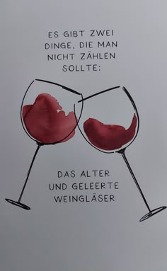 two wine glasses with red liquid in them and the words, es git zwei dinge die man nicht zahlen solite