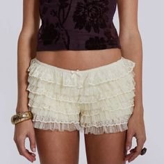 Made with soft, high-quality lace, they provide a flattering, low-waisted fit. Design: Layered ruffles with intricate lace detailing Waist Type: Low waist Closure Type: Elastic waistband for a snug fit Length: Short Fit: Regular fit, comfortable and breathable Size Guide: Size (cm) S Waist: 66 Length: 26 Hip: 86M Waist: 70 Length: 27 Hip: 90L Waist: 74 Length: 28 Hip: 94XL Waist: 78 Length: 29 Hip: 98 Size (inch) S Waist: 25.98 Length: 10.24 Hip: 33.86 M Waist: 27.56 Length: 10.63 Hip: 35.43 L W Low Waist Shorts, Bloomer Shorts, Skirt Tulle, Shorts Y2k, Ruffle Bloomers, Lace Layers, Bloomers Shorts, Jaded London, Skirt Maxi