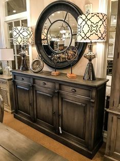 a large mirror on top of a dresser