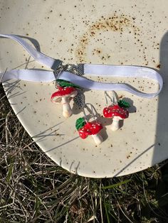 Amanita mushroom white velvet choker with mushrooms  Botanical Handcrafted clay Earrings  miniature mushroom necklace Wild forest jewelry Mushroom 🍄 made of baced polymer clay. Steel and velvet components. This choker measure 35+5cm If you want these  in a different color, write to me.  I can change colour finding All my work from polymer clay high quality. They are not afraid of cold, water and dust. All my products you will receive in a gift box! If you have any questions, please contact me. Clay Mushroom Necklace, Polymer Clay Mushroom Design Jewelry Gift, Unique White Mushroom Design Jewelry, Unique White Jewelry With Mushroom Design, Whimsical Adjustable Mushroom Design Jewelry, Whimsical Mushroom Print Jewelry Gift, Unique Adjustable Mushroom-shaped Jewelry, White Mushroom-shaped Jewelry With Mushroom Design, Adjustable Mushroom Design Pendant Jewelry