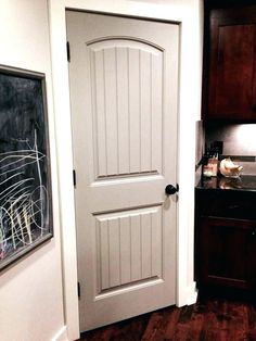 the door is open to show what's in the kitchen and how it looks like