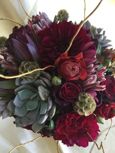 a bouquet of flowers sitting on top of a table