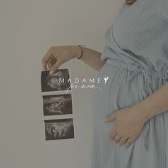 the pregnant woman is holding her hand over her belly