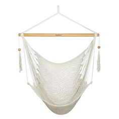 a white hammock hanging from a wooden pole