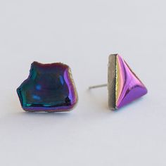 These unique asymmetrical black holographic stud earrings make a wonderful gift for any woman! The lovely shiny iridescent black color and the freeform style of these mismatched studs makes them a beautiful everyday earring that can be worn with all kinds of outfits for any occasion.  They are great for ladies who like unique and funky jewelry and since they are also hypoallergenic and do not contain nickel, they are also good for people with skin sensitivities. Handmade in Greece, these mismatc Iridescent Nickel-free Earrings As A Gift, Handmade Unique Iridescent Earrings, Handmade Iridescent Metal Earrings, Unique Iridescent Pierced Earrings, Nickel-free Iridescent Crystal Earrings For Party, Art Steampunk, Modern Party, Statement Art, Ceramic Earring