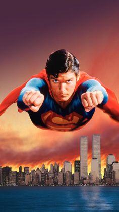 superman flying over the city with his arms outstretched