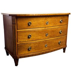 an old wooden dresser with brass knobs on it's sides and drawers, against a white background