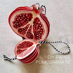 the pomegranate is cut in half and tied up