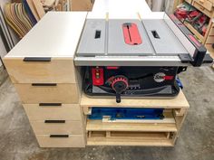 a table sawing on top of some drawers