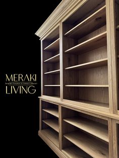 a wooden bookcase with several shelves on the top and bottom, in front of a black background