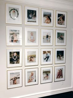 a wall with many pictures hanging on it's sides and a fireplace in the middle