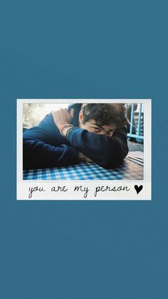 two people hugging each other with the words you are my person above them on a blue background