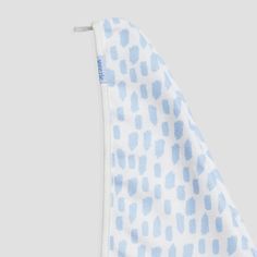 a blue and white polka dot towel hanging from a hook