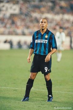 a man standing on top of a soccer field