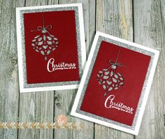 two cards with christmas ornaments on them, one is red and the other is silver