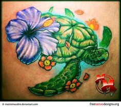 a tattoo with flowers and a turtle on it