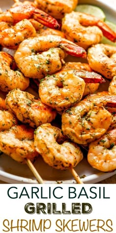 garlic basil grilled shrimp skewers on a white plate