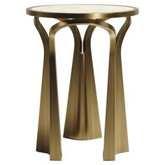 a gold metal table with marble top