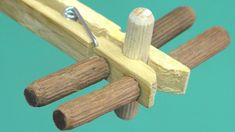 a pair of wood dows are attached to a wooden pole