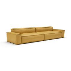 a yellow couch sitting on top of a white floor