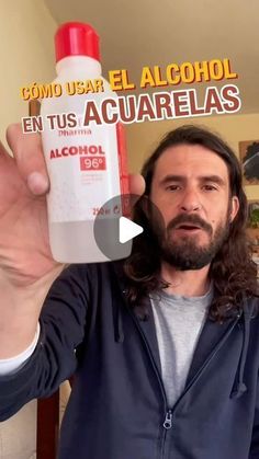 a man holding up a bottle of alcohol in front of his face with the caption