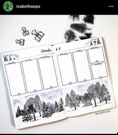 an open planner with trees and snow on it