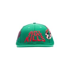 a green hat with the words art that kills on it and a skull in red