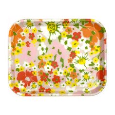 an orange, yellow and green flowered paper tray on a white background with flowers