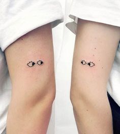 two people with matching tattoos on their legs, one has an eye and the other has a