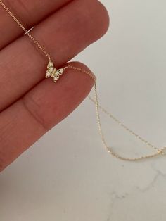 "14K Yellow Gold Gold Butterfly Necklace 16\"+2, Dainty Butterfly Chain, Minimalist Necklace, Layering Necklace, Butterfly Chain, Butterfly ♦ Materials: 14K Yellow Gold, Cubic Zirconia ♦ Available colors: Yellow Gold ♦ Necklace measurements: 16\" with a 2\" extender, for a total length of 18\". The chain is 1MM wide. The charm is 5MM -------------------------------------------------- ♦ -------------------------------------------------- MATERIALS All chains and pendants are made of 14K Solid Gold 14k Gold Butterfly Necklace, Dainty Butterfly Necklace, Small Gold Chain, Gold Dainty Necklace, Minimalist Butterfly, Chain Butterfly, Gold Butterfly Necklace, Necklace Measurements, Gold Minimalist Jewelry