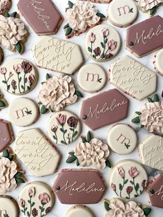 decorated cookies with names and flowers on them