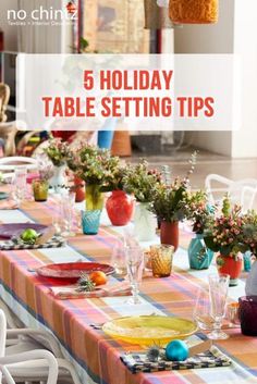 a table set with plates and glasses for holiday tablesettiing tips on a checkered table cloth