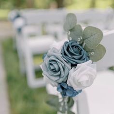 a bouquet of flowers sitting on top of a white chair