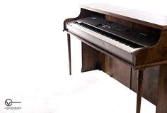 an upright piano is shown against a white background