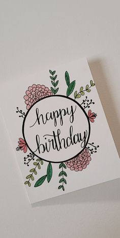 a happy birthday card with flowers on it