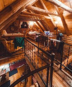 an attic with wooden floors and exposed ceilings