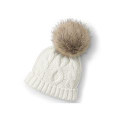 a white hat with a brown pom - pom