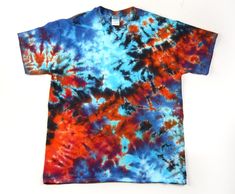 a tie dyed t - shirt with red, blue and orange colors