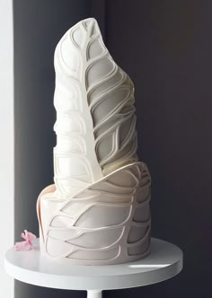 a white cake sitting on top of a table