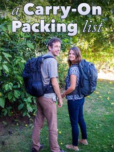 a man and woman standing next to each other with backpacks