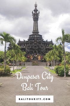 an ornate building with palm trees around it and the words dempasr city bali tour