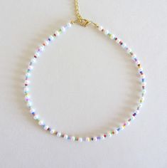 Colorful Pearl 4 mm Beaded Necklace, Beaded Necklace, Pearl  Necklace, Seed Bead Jewelry, Gifts for Her/Him, Beaded Choker, Glass pearls Beautiful necklace made of white glass pearls beads ( size 4 mm ), multicolore seed beads size 10/0. Measure the length of your neck with a measuring tape or you can use any thread, rope, or cable for telephone and after apply the measurements to a regular ruler. Choker is 13 inches with a 2 inches adjustable extender chain. 15 inches full length. White Beaded Necklace, Beads Choker, Bead Choker, Seed Beads Necklace, Seed Bead Choker, Seed Bead Necklaces, Jewelry Beads, Seed Bead Necklace Ideas, Summer Jewelry Diy