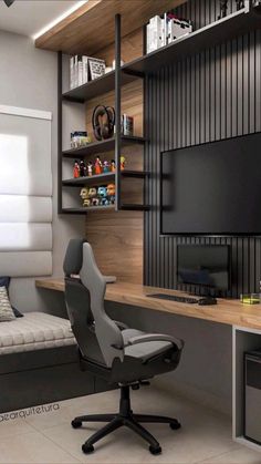 a room with a desk, chair and television on the wall in it's corner