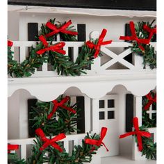 a white house with red bows on it