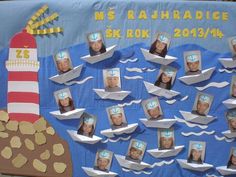 a bulletin board with pictures of people on paper boats in front of a light house